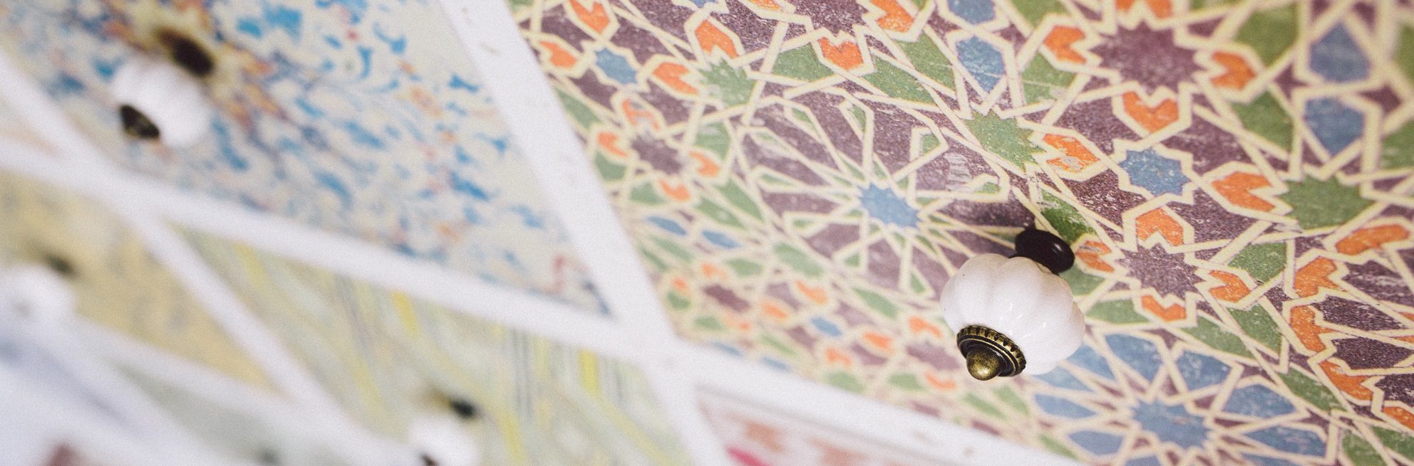 Close-up of colourful drawers with green, purple and orange design