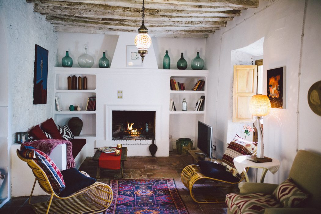A living room with a fireplace in a Spanish Villa Holiday home