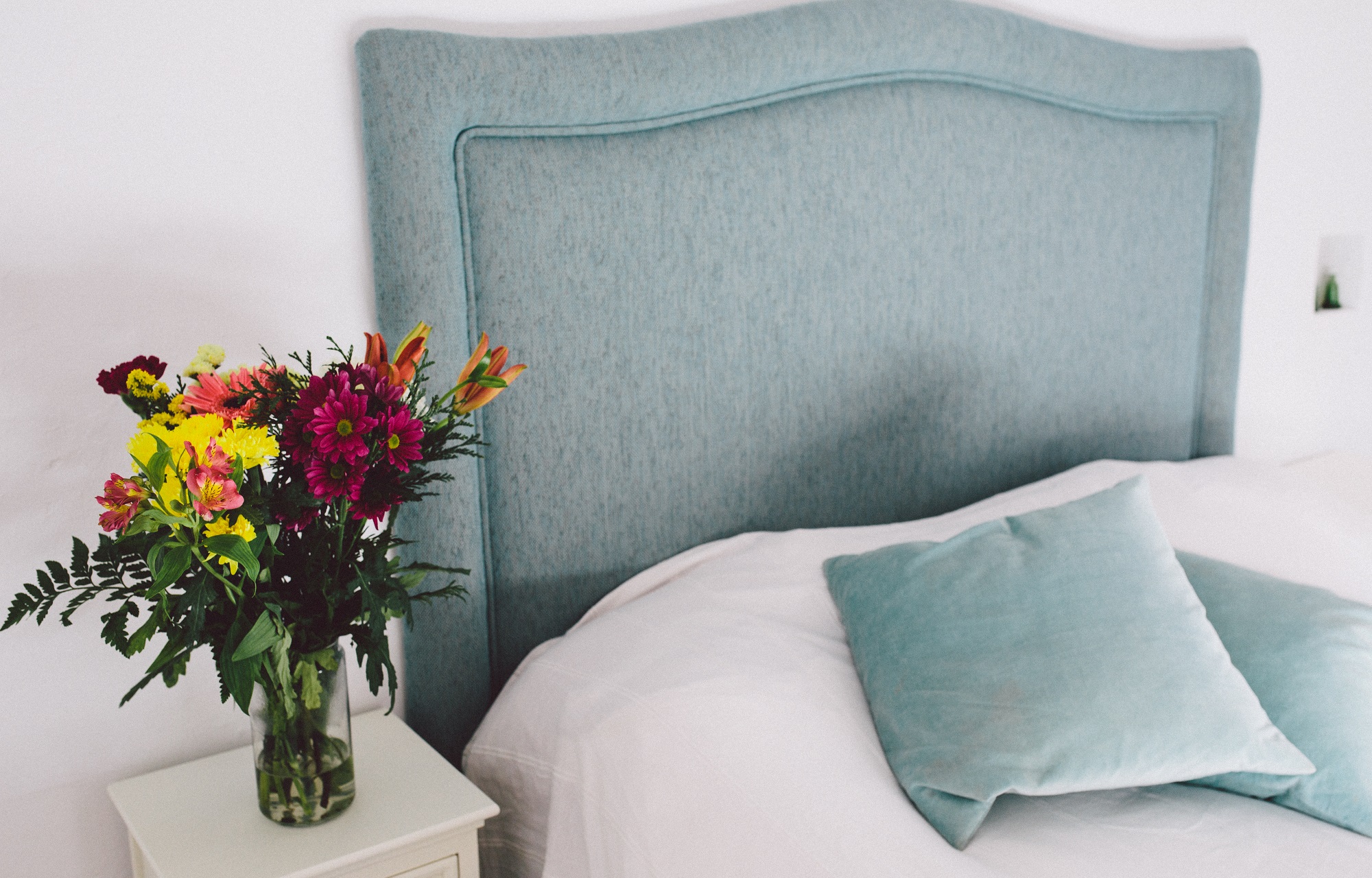 Master bedroom with fresh flowers from the garden