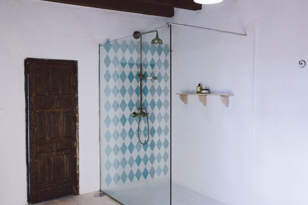 Modern bathroom with shower and white walls in a traditional Spain villa near Malaga