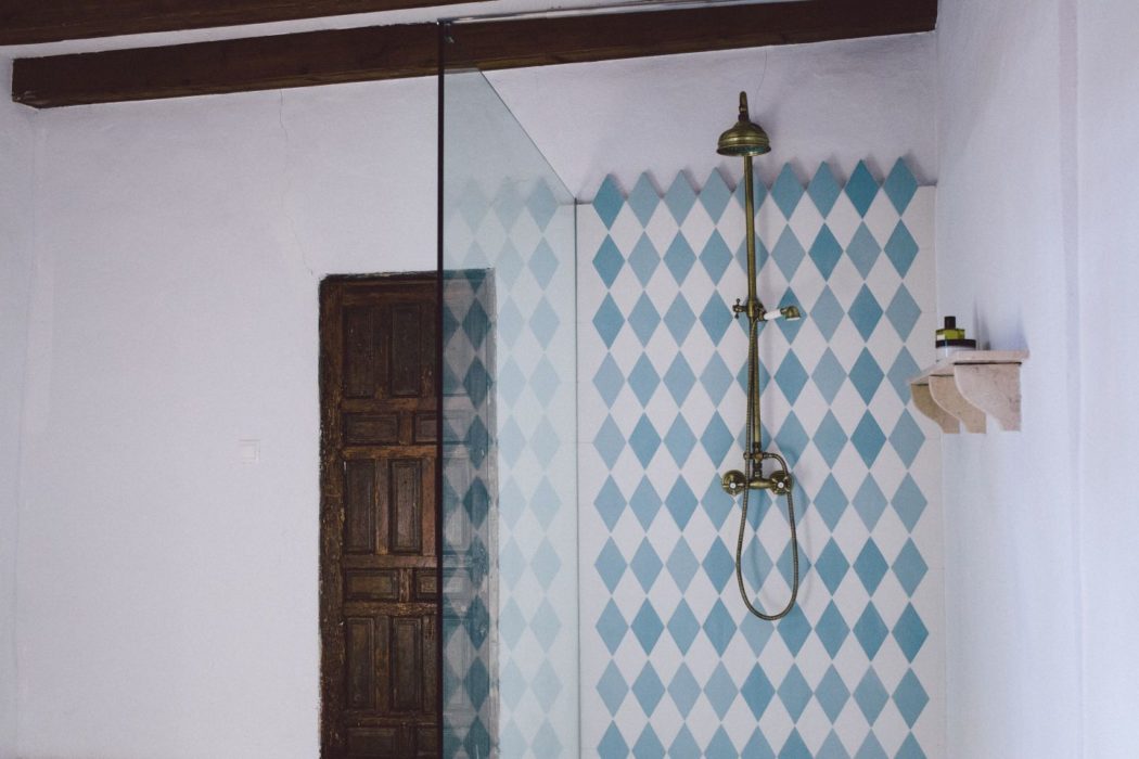 A shower with blue and white ceramic tiles in a Spain villa near Malaga