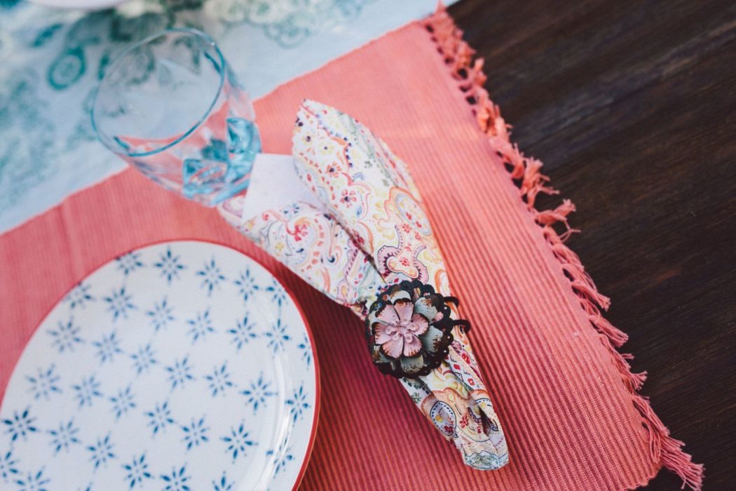 Pink and blue crockery and tablecloth