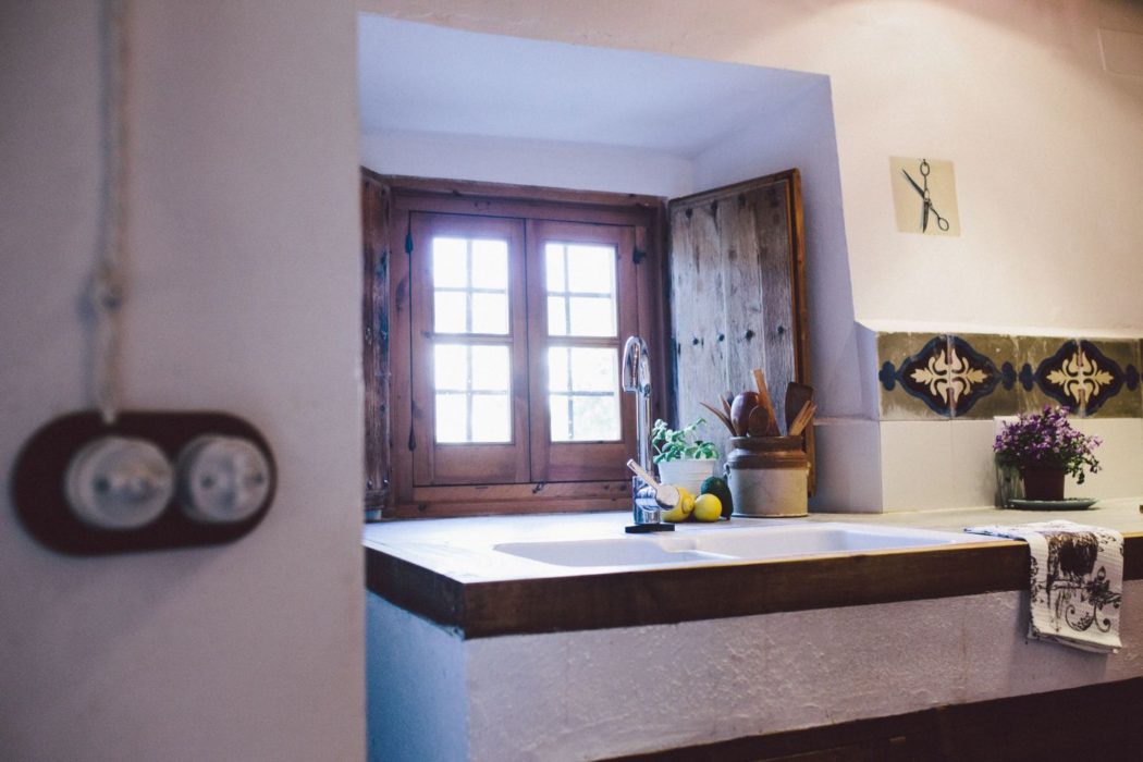 A kitchen sink in a traditional Spanish villa.